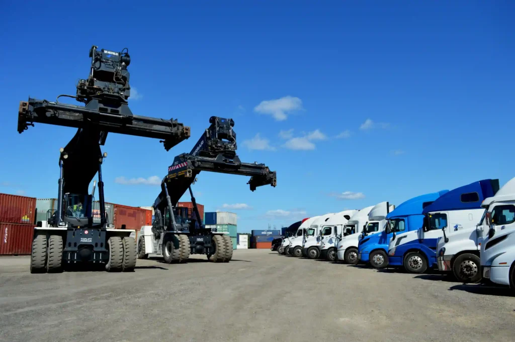 Reach stackers and S&R Trucking trucks at the Ontario container yard